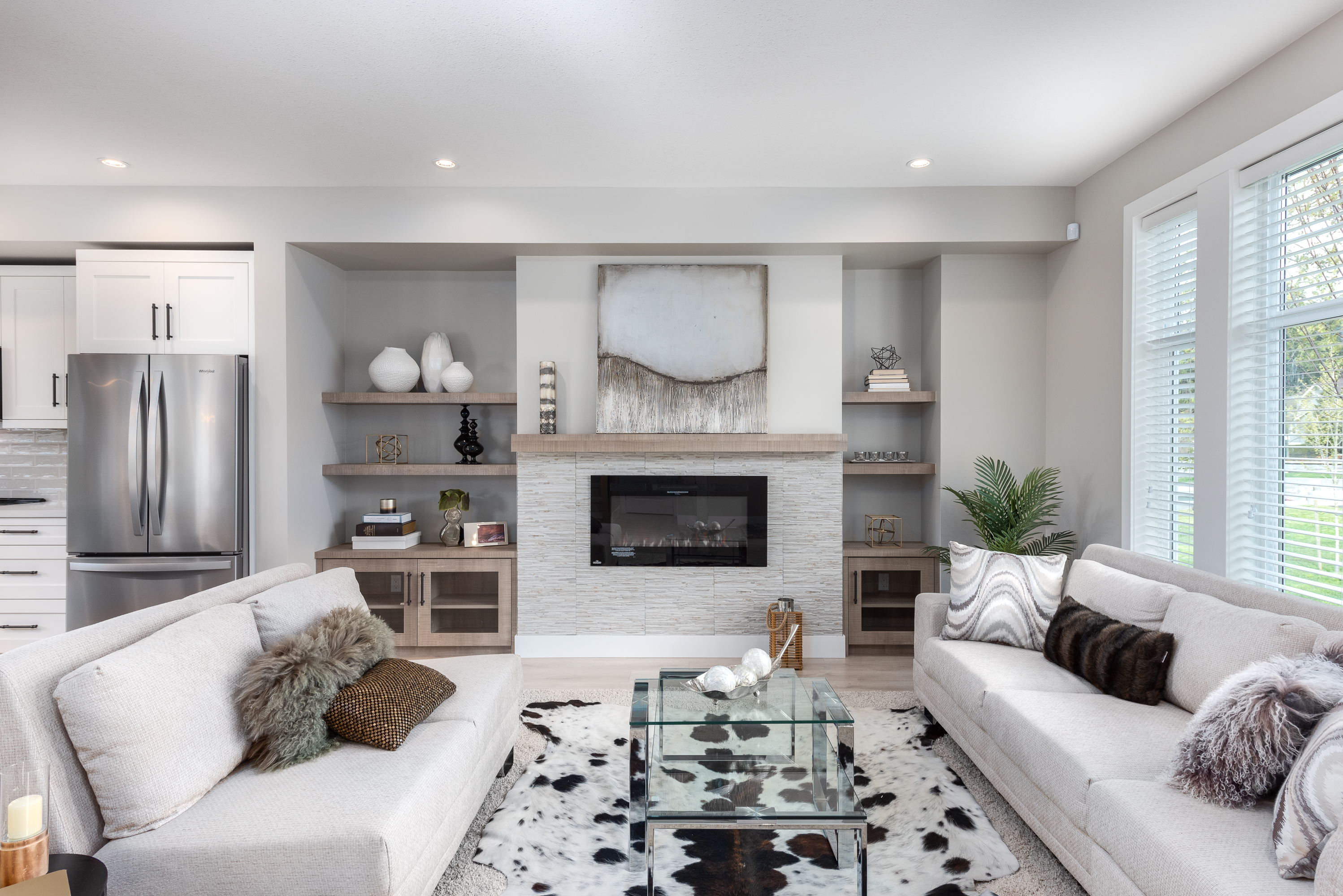 Bright open-concept living room with fireplace and modern furnishings