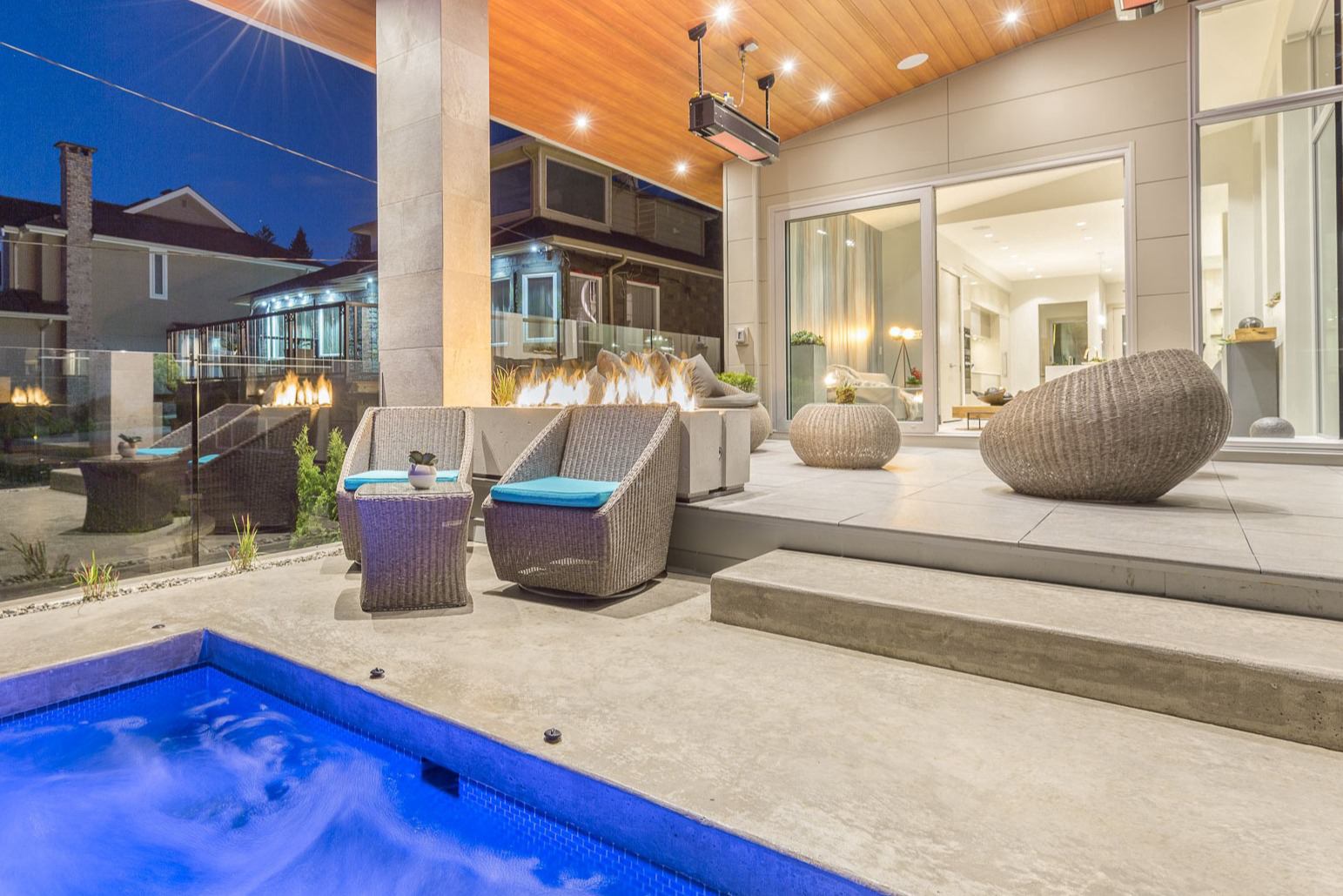 Luxury outdoor patio and pool at dusk